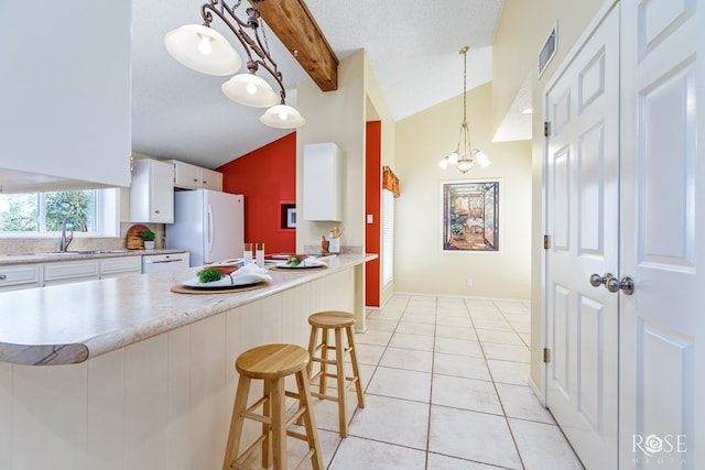 kitchen featuring lofted ceiling with beams, sink, white cabinets, a kitchen bar, and white appliances