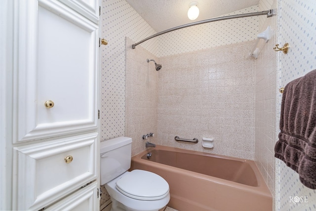 bathroom with shower / bath combination and toilet