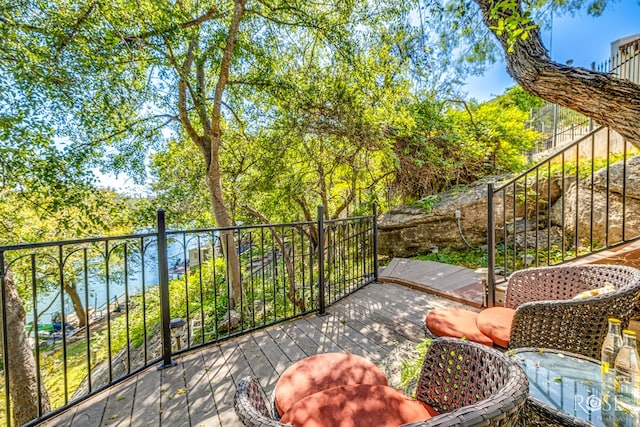 balcony featuring a water view