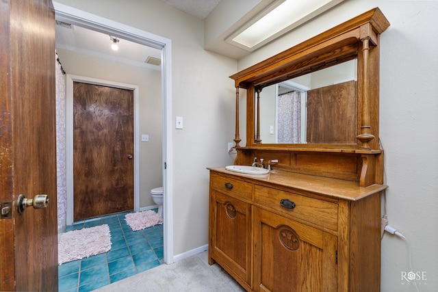 bathroom with vanity and toilet