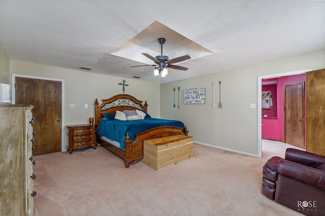 bedroom with light colored carpet and ceiling fan