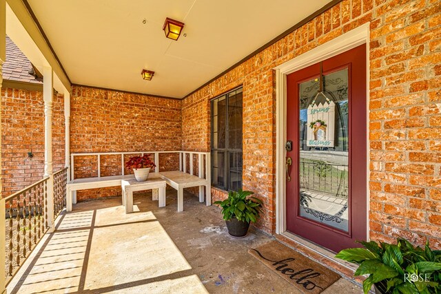 entrance to property featuring covered porch