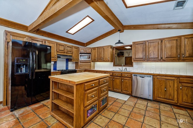 kitchen with vaulted ceiling with beams, sink, decorative backsplash, a center island, and black appliances