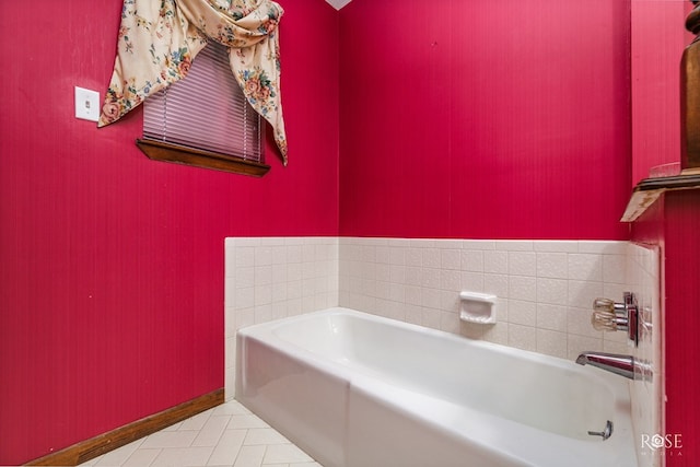 bathroom featuring tile patterned flooring and a washtub