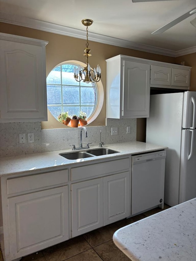 kitchen featuring sink, white cabinetry, crown molding, decorative light fixtures, and white appliances