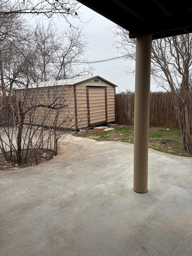 view of patio with a storage shed