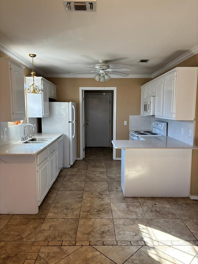 kitchen featuring pendant lighting, white appliances, white cabinetry, and sink