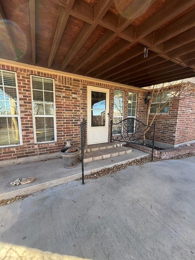 doorway to property with a patio area