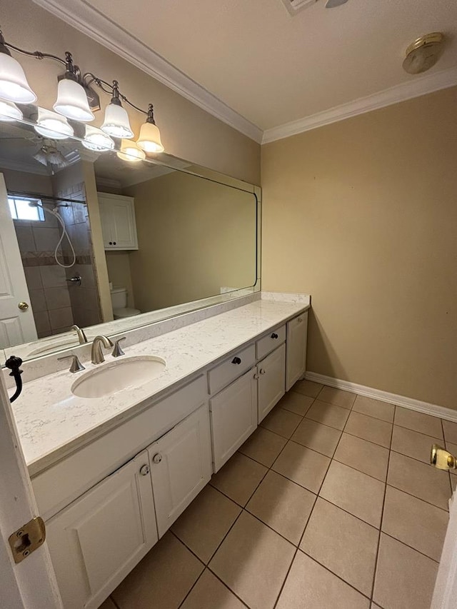 bathroom featuring ornamental molding, vanity, tile patterned floors, and toilet