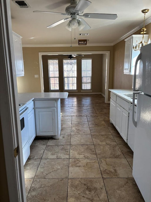 kitchen featuring crown molding, white appliances, and white cabinets