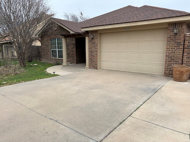 ranch-style house featuring a garage