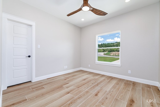 unfurnished room featuring ceiling fan and light hardwood / wood-style flooring