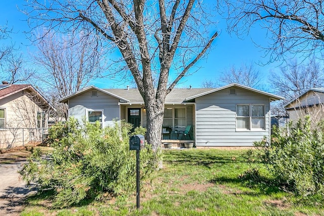 view of front of home with a front lawn