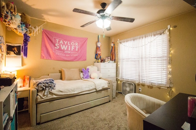 bedroom featuring ceiling fan and carpet floors