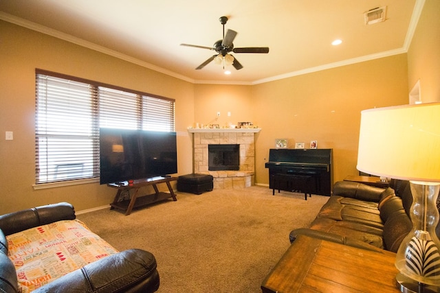 living room with carpet floors, visible vents, crown molding, and ceiling fan