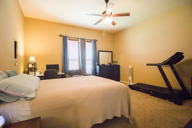bedroom featuring ceiling fan and carpet