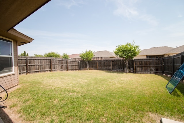 view of yard featuring a fenced backyard