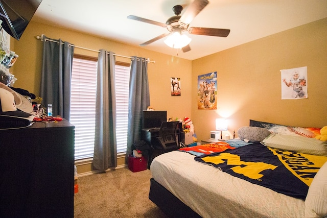 carpeted bedroom with ceiling fan
