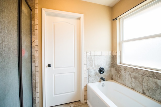 bathroom featuring a bath
