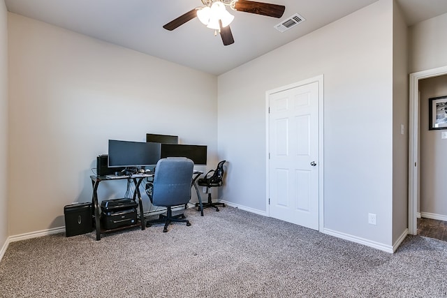 carpeted home office with ceiling fan