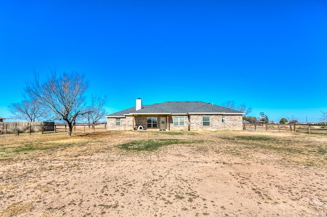 rear view of property featuring a rural view