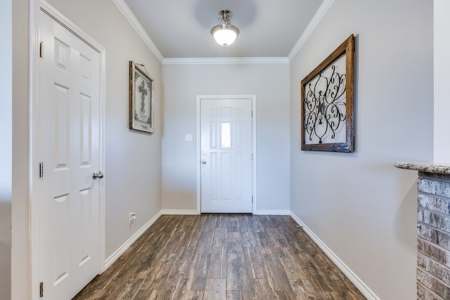 entrance foyer featuring ornamental molding and dark hardwood / wood-style flooring