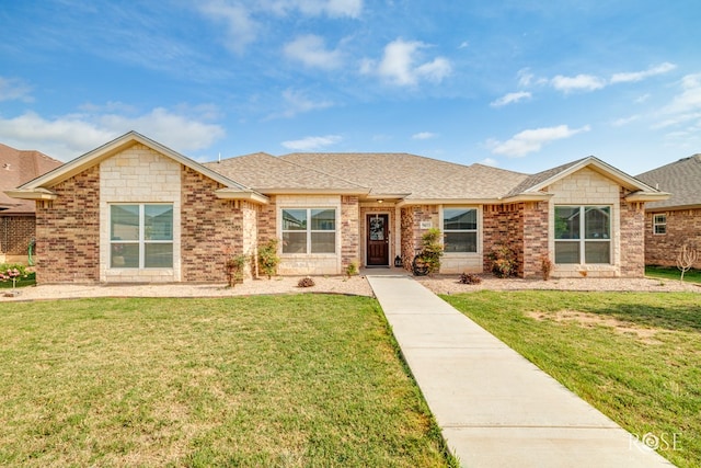 5033 Scarlet Oak Ln, San Angelo, TX 76904 - single story home featuring a front yard, roof with shingles, and brick siding