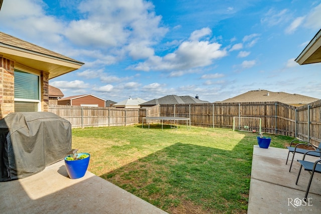5033 Scarlet Oak Ln, San Angelo, TX 76904 - view of yard featuring a patio and a trampoline