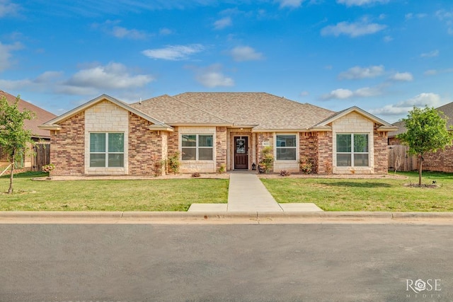 5033 Scarlet Oak Ln, San Angelo, TX 76904 - view of front of house featuring brick siding and roof with shingles