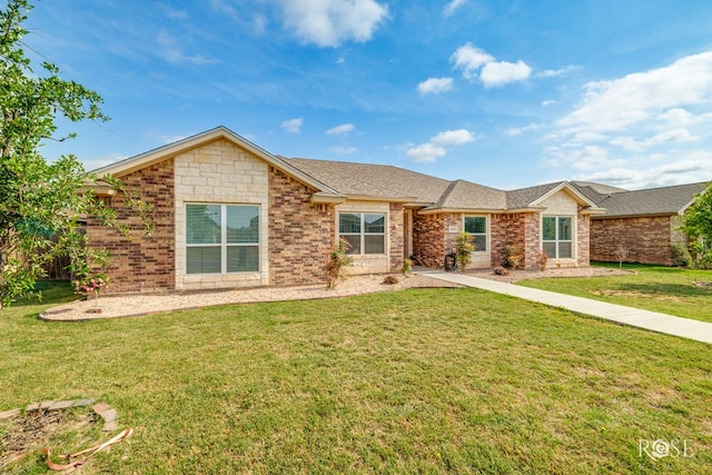 5033 Scarlet Oak Ln, San Angelo, TX 76904 - ranch-style house featuring a front yard, brick siding, and roof with shingles
