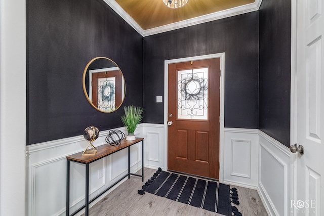 5033 Scarlet Oak Ln, San Angelo, TX 76904 - foyer entrance featuring wainscoting, a decorative wall, and wood finished floors