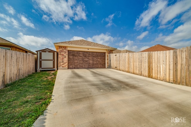 5033 Scarlet Oak Ln, San Angelo, TX 76904 - garage with a storage unit and concrete driveway