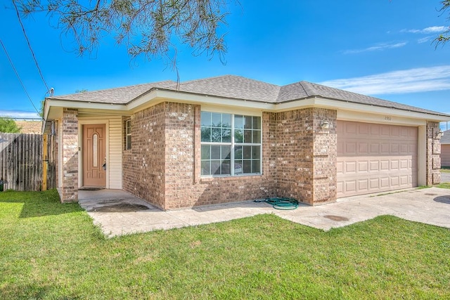 2902 Freeland St, San Angelo, TX 76901 - single story home with an attached garage, brick siding, and driveway