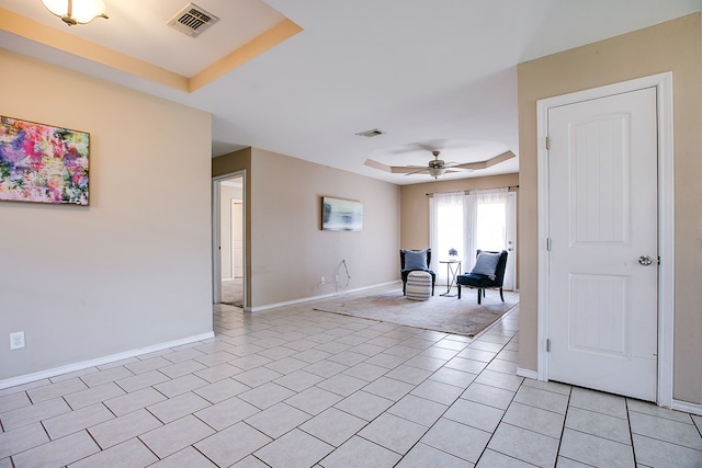 2902 Freeland St, San Angelo, TX 76901 - sitting room featuring a raised ceiling, a ceiling fan, baseboards, and light tile patterned flooring