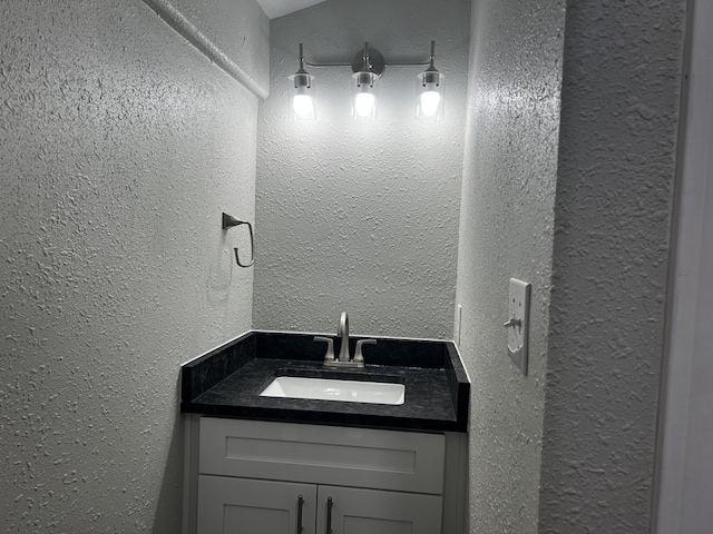 421 Howard St, San Angelo, TX 76901 - bathroom with a textured wall and vanity