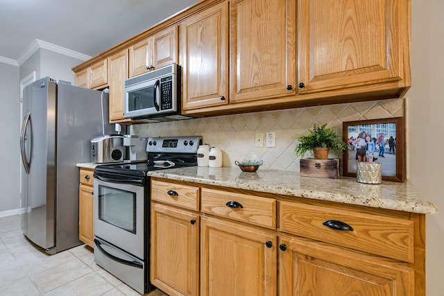 kitchen featuring light tile patterned floors, crown molding, stainless steel appliances, tasteful backsplash, and light stone counters