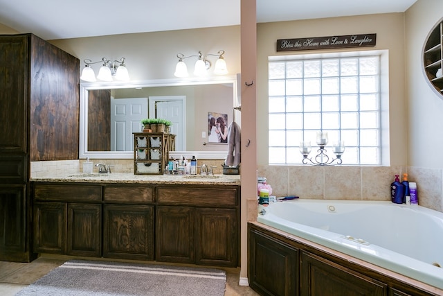 bathroom with vanity and a tub to relax in