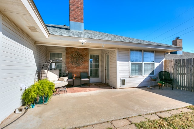 rear view of house featuring a patio