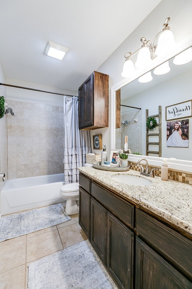 full bathroom with shower / tub combo with curtain, vanity, and toilet