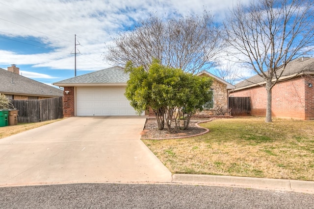 view of front of property with a garage and a front lawn