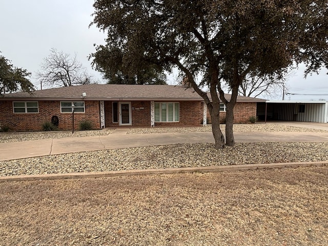 ranch-style home with a carport