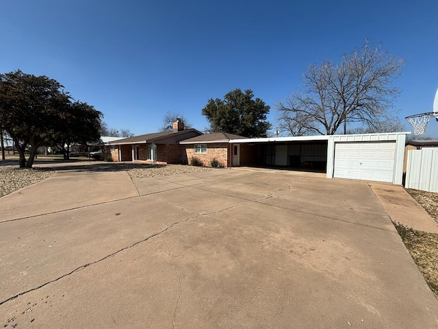 ranch-style house featuring a carport