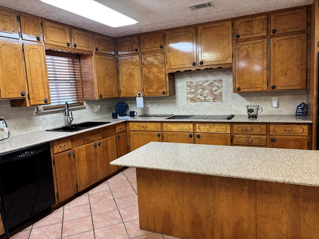 kitchen with light tile patterned flooring, sink, tasteful backsplash, a textured ceiling, and black appliances