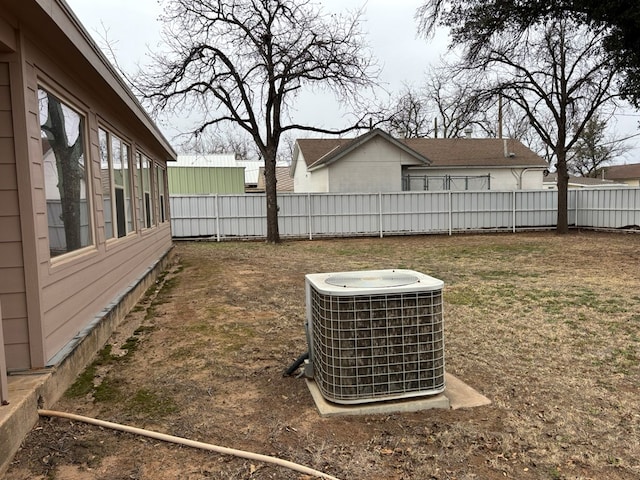 view of yard with central air condition unit