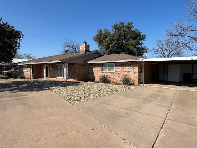 ranch-style home featuring a carport