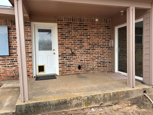 doorway to property featuring a patio area