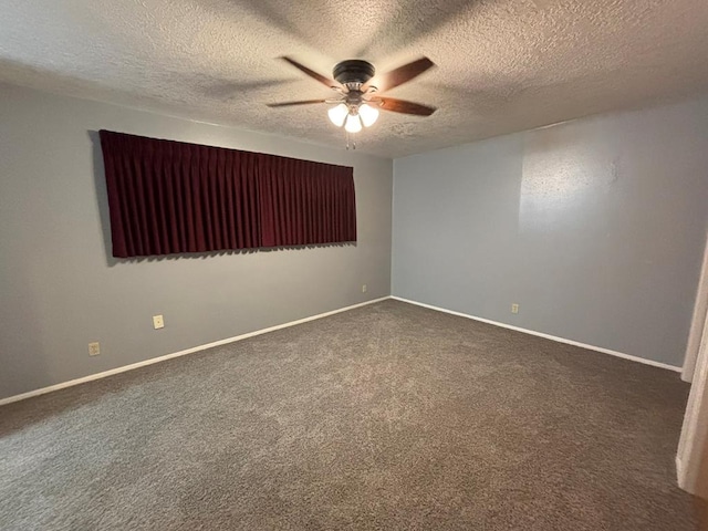 carpeted empty room featuring a textured ceiling and ceiling fan