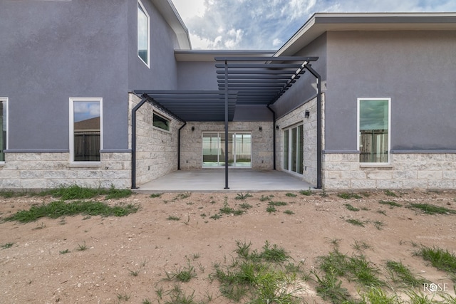 rear view of property with a patio