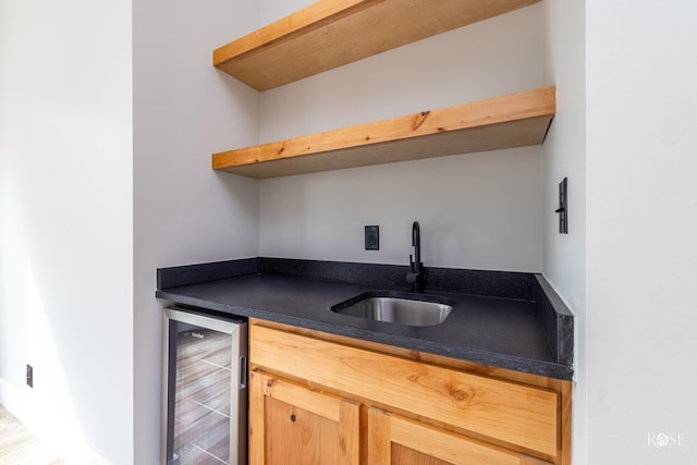 bar with wine cooler and sink