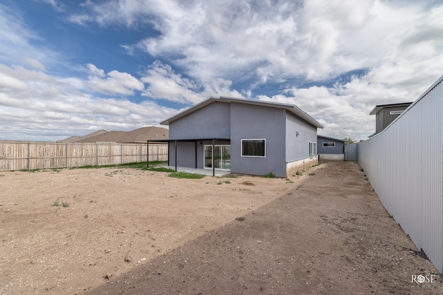 rear view of property with a patio area